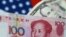 FILE - U.S. Dollar and China Yuan notes are seen in this picture illustration.