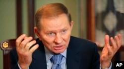 FILE - Former Ukrainian president Leonid Kuchma gestures during an interview with The Associated Press in Kyiv, Ukraine, Feb. 5, 2010.