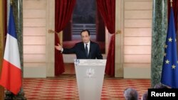 French President Francois Hollande addresses a news conference at the Elysee Palace in Paris, Jan. 14, 2014. 
