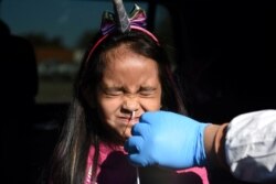 Valerie Dominguez, whose results came back negative, is tested for coronavirus disease (COVID-19) at United Memorial Medical Center in Houston, Texas, Dec. 9, 2020.