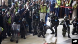 FILE-In this November 8, 2016 photo, Nigerian Air Force special unit conducts a counter-terrorism exercise at the departure hall of the Murtala Muhammed International Airport in Lagos, Nigeria.