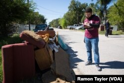 Mauricio “Chele” Iglesias, a Houston-based community organizer at Worker’s Defense Project, walks door-to-door to inform undocumented working families of their rights amid rising cases of exploitation.