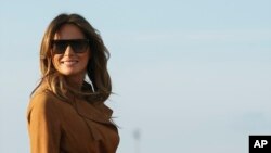 FILE - First lady Melania Trump boards a plane, Oct. 1, 2018, in Andrews Air Force Base, Md., en route to Africa. 
