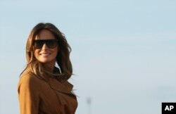 FILE - First lady Melania Trump boards a plane, Oct. 1, 2018, in Andrews Air Force Base, Md., en route to Africa.