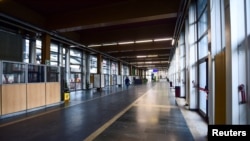 An empty hall in Palazzo Nuovo University of Turin is pictured after the government's decree to close cinemas, schools and urge people to work from home and not stand closer than one meter to each other, March 5, 2020. 