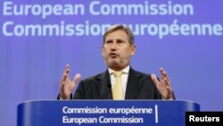 FILE - European Enlargement Negotiations Commissioner Johannes Hahn addresses a news conference at the EU Commission headquarters in Brussels, Belgium, Sept. 17, 2015. 