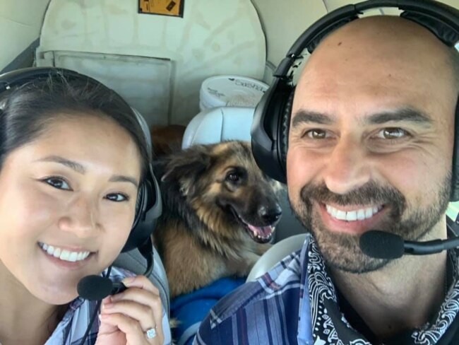 Pilot Eduard Seitan and his fiancee, Debbie, sit in the cockpit of his plane. They are preparing to deliver a rescue dog to its new home.