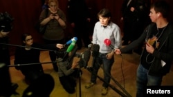 Yekaterina Samutsevich, a member of punk group Pussy Riot who was released from jail after her sentence was suspended on appeal, speaks to the media before a court hearing in Moscow, January 30, 2013.