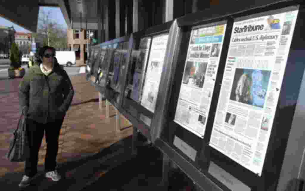 A woman reads Monday's U.S. newspapers front pages outside the Newseum in Washington November 29, 2010. Sunday's release of documents obtained by the whistleblower website WikiLeaks exposed the inner workings of U.S. diplomacy in recent years, including c