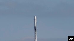 FILE - A Falcon 9 SpaceX rocket with a payload of approximately 60 satellites for SpaceX's Starlink broadband network lifts off from Space Launch Complex 40 at the Cape Canaveral Air Force Station in Cape Canaveral, Fla.,Jan. 29, 2020.
