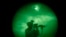 FILE - A U.S. soldier patrols at night in Khost province, Afghanistan, seen through night vision equipment. A U.S. official said Thursday that authorities are working to rescue an American citizen believed to have been kidnapped in the area.