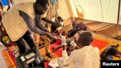 (FILE) Sudanese refugees receive medical support in Chad.