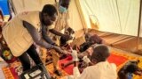 FILE: Wounded Sudanese refugees, who fled conflict from West Darfur, receive medical support from MSF and health ministry staff at a hospital in Adre, Chad June 16, 2023 in this handout image. Courtesy of MSF/Handout via REUTERS