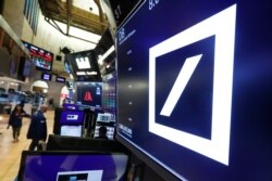 The logo for Deutsche Bank appears above a trading post on the floor of the New York Stock Exchange, July 8, 2019.