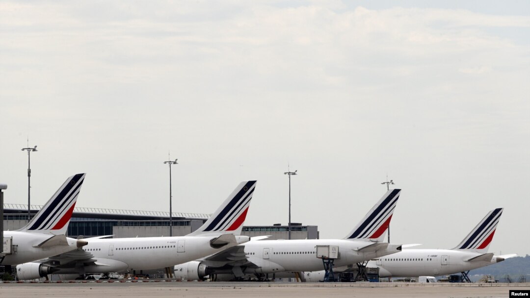 FILE - Air France planes are parked on the tarmac at the Paris Charles de Gaulle airport in Roissy, France, June 19, 2019. 