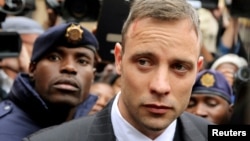 FILE - Oscar Pistorius leaves court after appearing for the 2013 killing of his girlfriend, Reeva Steenkamp, in the North Gauteng High Court in Pretoria, South Africa, on June 14, 2016. Pistorius was granted parole on Nov. 24, 2023.