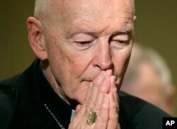 FILE - Cardinal Theodore McCarrick prays during the United States Conference of Catholic Bishops' annual fall assembly in Baltimore, Maryland. McCarrick was recently forced to resign over the clergy sex abuse scandal.