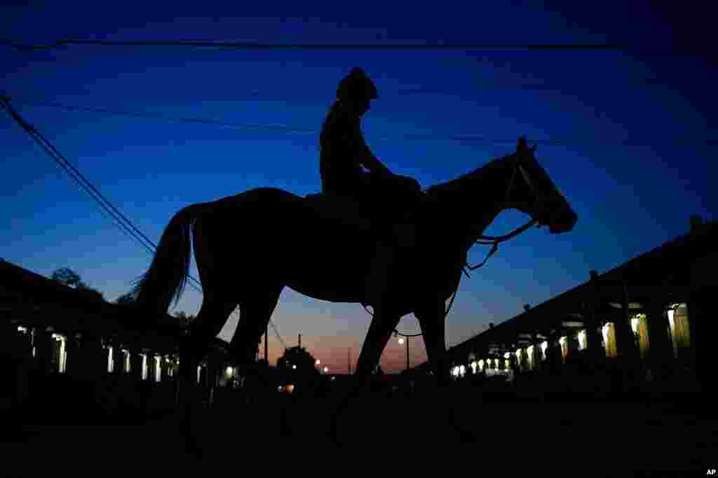 A jockey heads back to the barns at Churchill Downs in Louisville, Ky. The 147th running of the Kentucky Derby is scheduled for May 1.