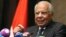FILE - Egypt's Prime Minister Hazem el-Beblawi gestures during a news conference in Abu Dhabi, Oct. 27, 2013. 