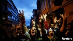 Supporters celebrate early election results outside the pro-Kurdish Peoples' Democratic Party (HDP) headquarters in Istanbul, Turkey, June 7, 2015. Partial results from Turkey's parliamentary election on Sunday put the ruling AK Party on 43.6 percent of t