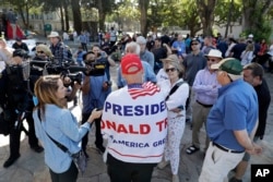 Donald Trump supporter Arthur Schaper, center, argues opposing views during a free speech rally, Aug. 27, 2017, in Berkeley, Calif.