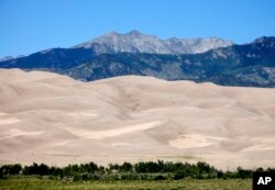 A photo taken Aug. 14, 2010, shows Great Sand Dunes National Park and Preserve at the base of the 14,000-foot Sangre de Cristo Mountains in Mosca, Colorado.