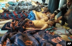 Victims of the suspected chemical weapons attack lie on the ground, in Khan Sheikhoun, in the northern province of Idlib, Syria. The death toll from a suspected chemical attack on a northern Syrian town rose Wednesday as rescue workers found more terrified survivors.