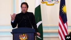 FILE - Pakistan's Prime Minister Imran Khan speaks during a press conference in Putrajaya, Malaysia, Nov. 21, 2018.