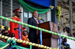 FILE - Hussein Ali Mwinyi makes an address after taking the oath of office in Zanzibar, Tanzania, Nov. 2, 2020.