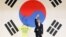 Moon Jae-in waves to supporters as he celebrates his win in the primary of his party in Goyang, north of Seoul September 16, 2012. Moon, who won all of the party's regional primaries, is one of leading candidates for the December 19 presidential election.