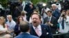 FILE - Conservative radio host Sebastian Gorka, right, speaks with White House correspondent for Playboy magazine Brian Karem, after President Donald Trump spoke about the 2020 census in the Rose Garden of the White House, in Washington, July 11, 2019.