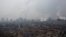 FILE - Smokestacks and cooling towers of a power plant rise above a low-rise neighborhood that borders a steel plant in Anyang, Henan province, China, Feb. 18, 2019.