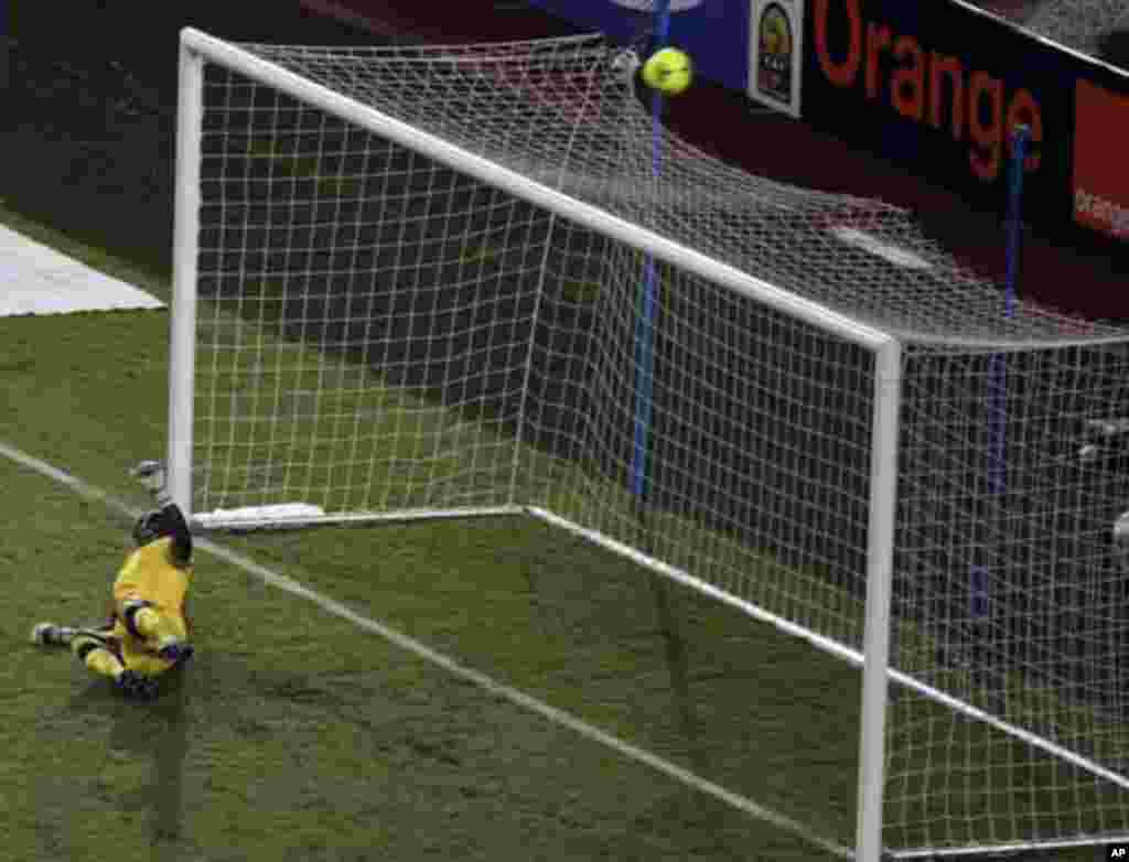 Zambia's goalkeeper Kennedy Mweene watches the ball as Ivory Coast's Dider Drogba misses his penalty during their African Nations Cup final soccer match at the Stade De L'Amitie Stadium in Libreville February 12, 2012.