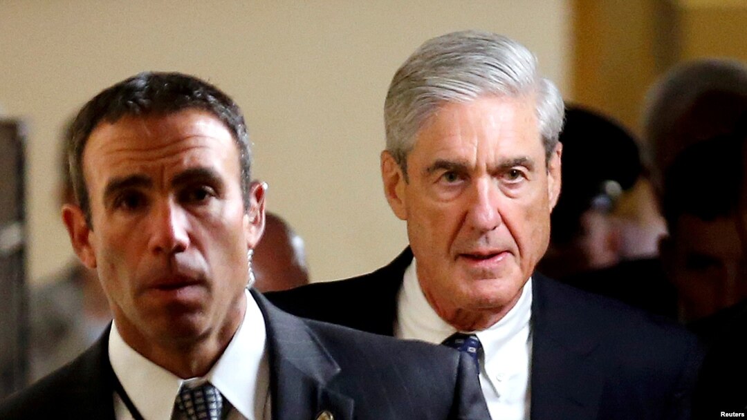 FILE : Special Counsel Robert Mueller, right, departs after briefing members of the U.S. Senate on his investigation into potential collusion between Russia and the Trump campaign on Capitol Hill in Washington, June 21, 2017.