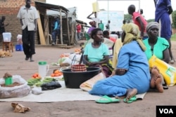 FILE - Women are seen selling food stuff at a market in Mungula market, at a refugee settlement in Adjumani district, northern Uganda, June 15, 2017. (H. Athumani/VOA)