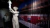 A visitor looks at a statue of the Goddess of Democracy at Hong Kong's museum dedicated to the Tiananmen Square pro-democracy protests, in Tsim Sha Tsui, Apr. 26, 2014. 