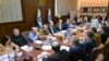 This handout picture released by the Israeli Government Press Office (GPO) shows Prime Minister Benjamin Netanyahu (6-L), heading a security cabinet meeting to vote on a Gaza ceasefire and hostage release deal that should take effect ton January 19, in Je