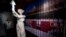 A visitor looks at a statue of the Goddess of Democracy at Hong Kong's museum dedicated to the Tiananmen Square pro-democracy protests, in Tsim Sha Tsui, Apr. 26, 2014. 
