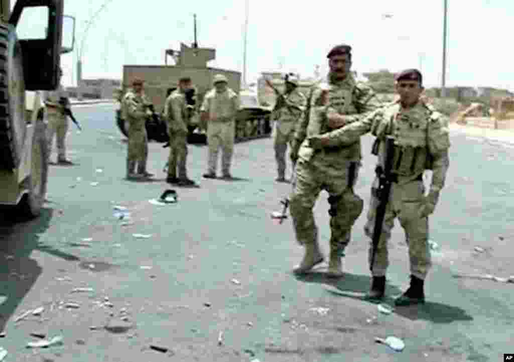 This image taken from video obtained from the Iraqi Military shows Iraqi soldiers during clashes with militants in the northern city of Mosul, Iraq, June 9, 2014.