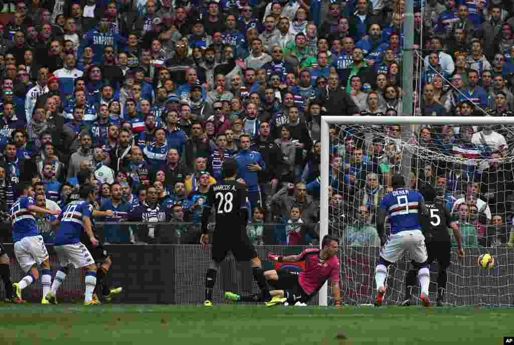 Sampdoria midfielder Luca Rizzo, left, scores a goal during a Serie A soccer match between Sampdoria and Fiorentina, in Genoa, Italy.