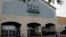 A shopper leaves a Whole Foods Market, June 16, 2017, in San Antonio, Texas.