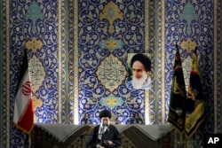 Iran's Supreme Leader Ayatollah Ali Khamenei delivers speech to paramilitary Basij force, saying pressure from economic sanctions will never force country into unwelcome concessions in nuclear negotiations, Imam Khomeini Grand Mosque, Tehran, Nov. 20, 201