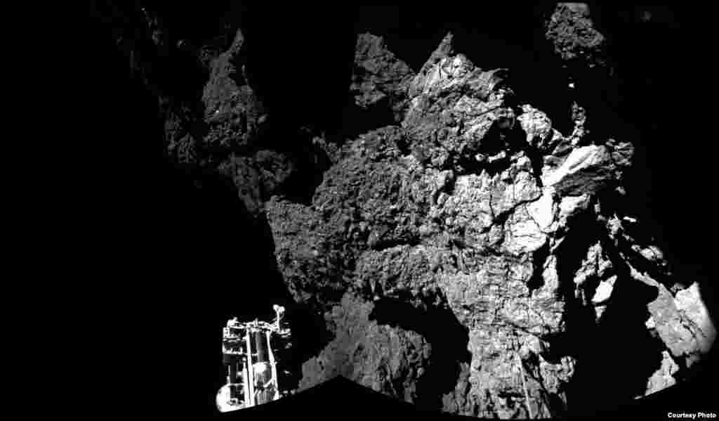 Rosetta&rsquo;s lander Philae is safely on the surface of Comet 67P/Churyumov-Gerasimenko, as these first two CIVA images confirm. One of the lander&rsquo;s three feet can be seen in the foreground. The image is a two-image mosaic, Nov. 13, 2014. (Courtesy: European Space Agency, photo released Nov. 13, 2014)