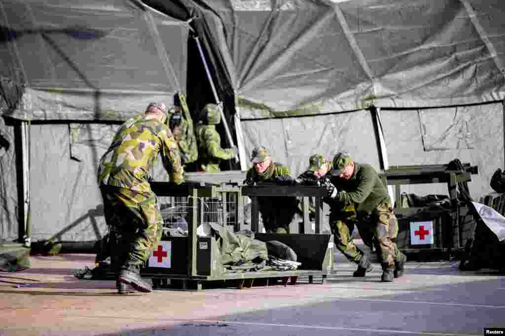 Military members work at a military field hospital as the spread of coronavirus disease (COVID-19) continues, at the Ostra Sjukhuset hospital area in Gothenburg, Sweden.