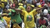 Supporters of Tanzanian ruling party, Chama Cha Mapinduzi welcoming President Jakaya Kikwete before addressing a rally