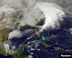 Storm clouds are seen on the east coast of the United States in this NASA handout satellite image taken at 1955 GMT, December 26, 2012.