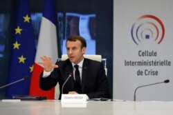 French President Emmanuel Macron attends a meeting at the emergency crisis center of the Interior Ministry in Paris, March 20, 2020.