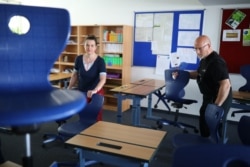A classroom is prepared for a reopening amid a coronavirus pandemic, at a grammar school in Kleinmachnow, Germany, April 16, 2020.