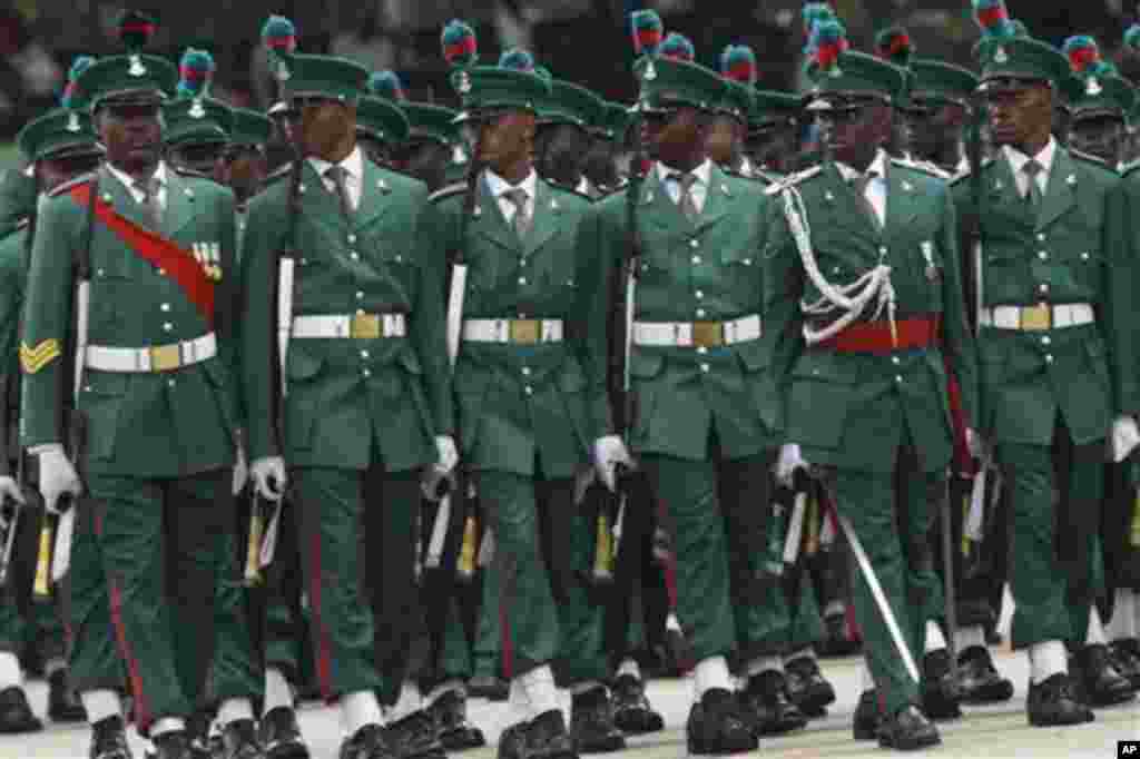 Nigeria soldiers match during the inauguration ceremony of Nigeria President Goodluck Jonathan at the main parade ground in Nigeria's capital of Abuja, Sunday, May 29, 2011. Jonathan was sworn in Sunday for a full four-year term as president of Nigeria an