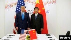 美国总统特朗普和中国国家主席习近平2019年6月29日在日本大阪G20峰会间隙举行双边会谈前合影